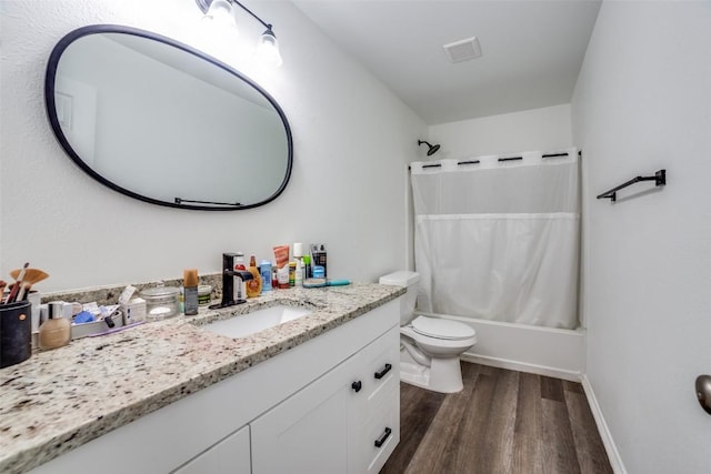 full bathroom featuring shower / tub combo with curtain, vanity, toilet, and hardwood / wood-style floors