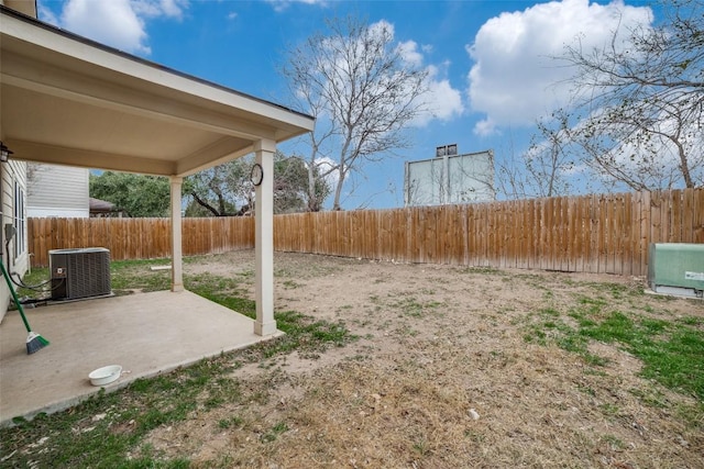 view of yard with a patio area and central air condition unit