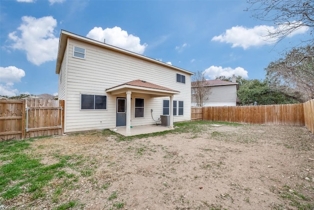 back of property featuring cooling unit and a patio area