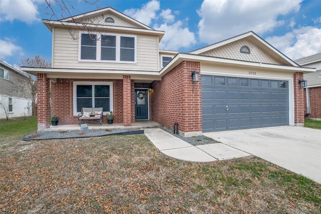 view of property featuring a garage and a porch