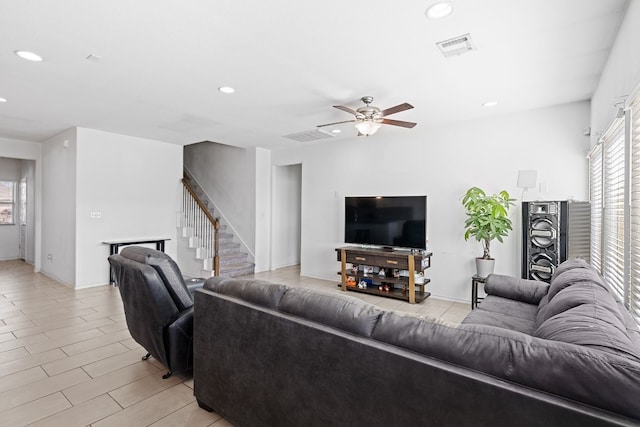 11813 Carrizo Springs Path, Manor, TX 78653 - living room featuring recessed lighting, healthy amount of natural light, a ceiling fan, and stairway