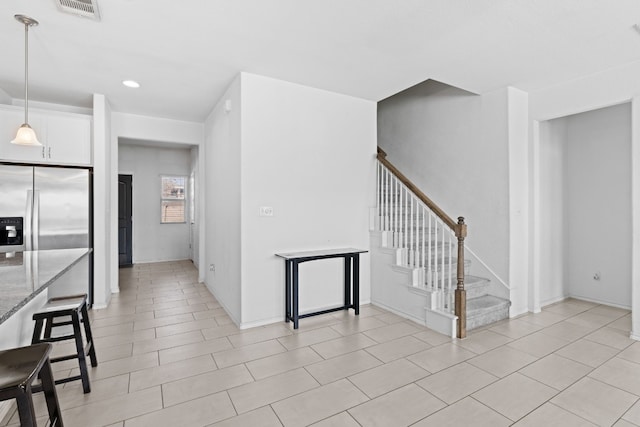 11813 Carrizo Springs Path, Manor, TX 78653 - unfurnished living room with stairway, recessed lighting, baseboards, and light tile patterned flooring