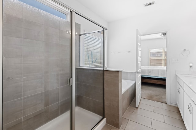 11813 Carrizo Springs Path, Manor, TX 78653 - bathroom with vanity, a garden tub, a stall shower, and connected bathroom