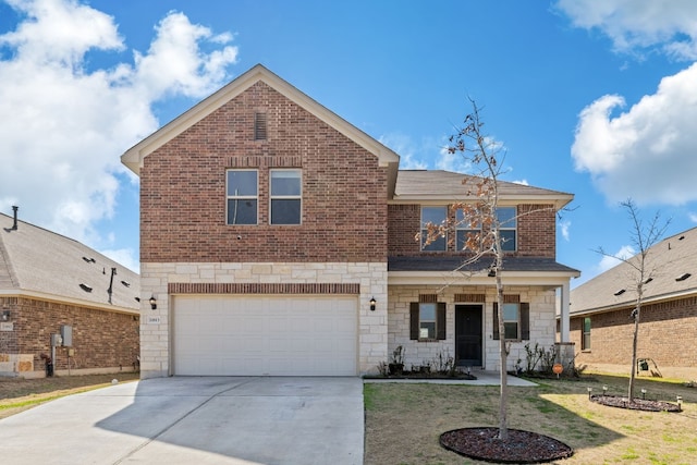 traditional home featuring an attached garage, brick siding, driveway, and stone siding