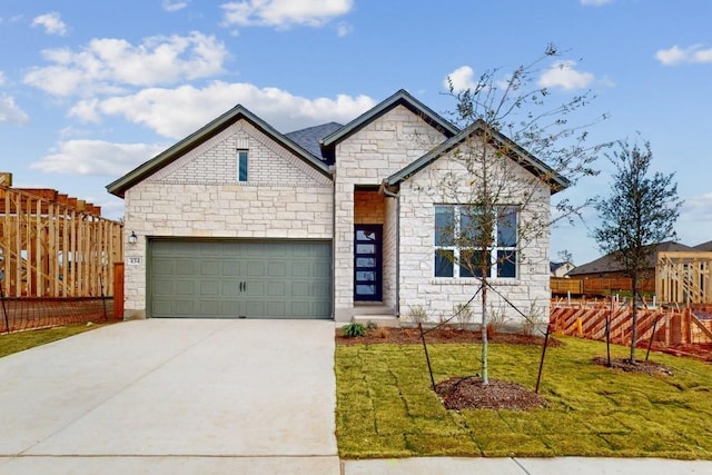 view of front facade featuring stone siding, driveway, a front lawn, and fence