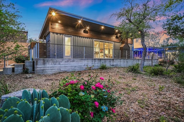 view of property exterior at dusk