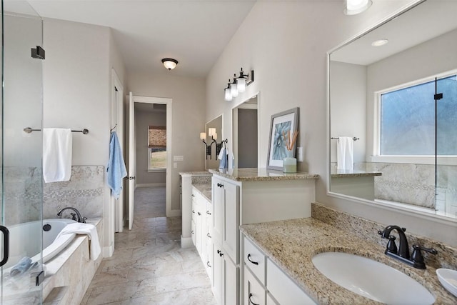216 Fairlake Cir, Austin, TX 78734 - full bath featuring vanity, a bath, and a shower with door