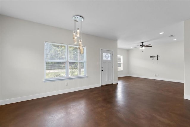 foyer entrance with ceiling fan