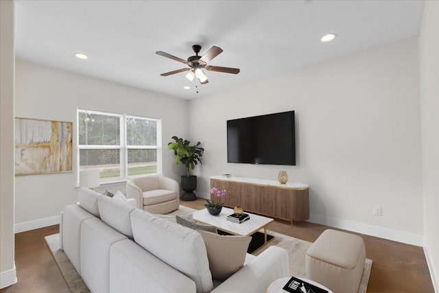 living room with hardwood / wood-style floors and ceiling fan