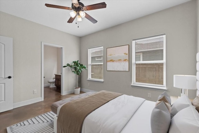 bedroom featuring ceiling fan and ensuite bathroom