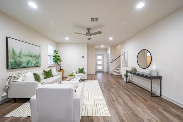 living room with ceiling fan and wood-type flooring