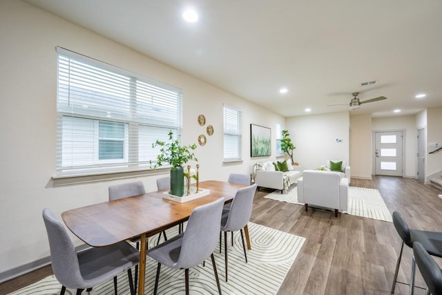 dining room featuring light hardwood / wood-style floors and ceiling fan