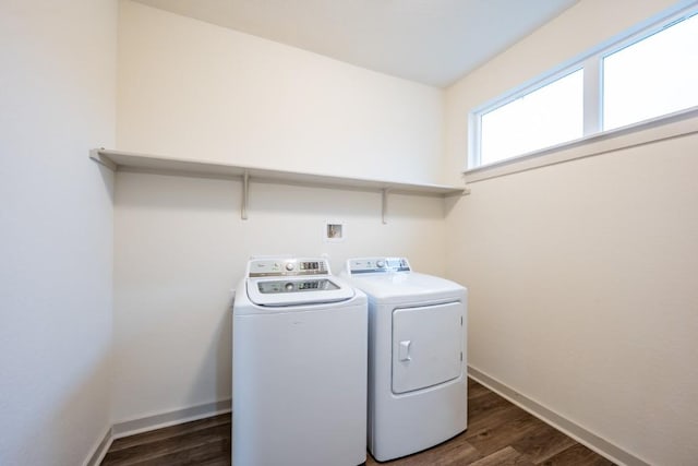 clothes washing area featuring dark hardwood / wood-style flooring and separate washer and dryer