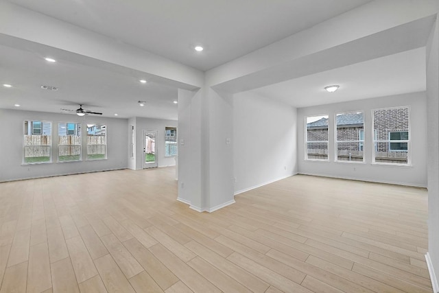 unfurnished room with a ceiling fan, visible vents, light wood finished floors, and recessed lighting