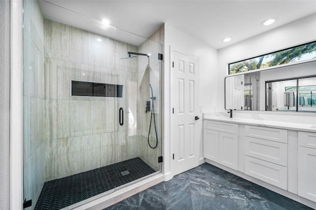 3507 Lovage Dr, Austin, TX 78727 - bathroom featuring marble tiled flooring, a shower stall, vanity, and recessed lighting