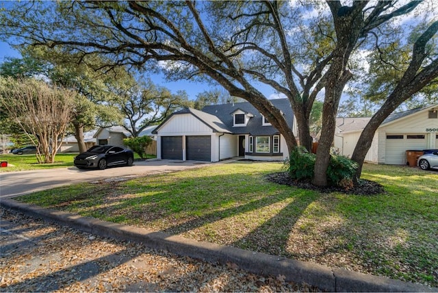 3507 Lovage Dr, Austin, TX 78727 - view of front facade with driveway, a garage, and a front yard