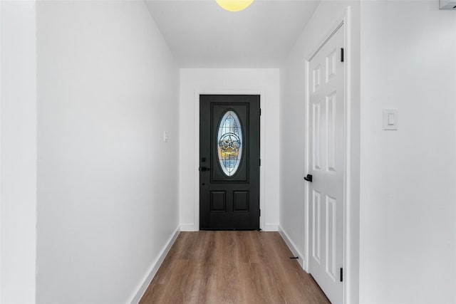 3507 Lovage Dr, Austin, TX 78727 - doorway to outside featuring wood finished floors and baseboards