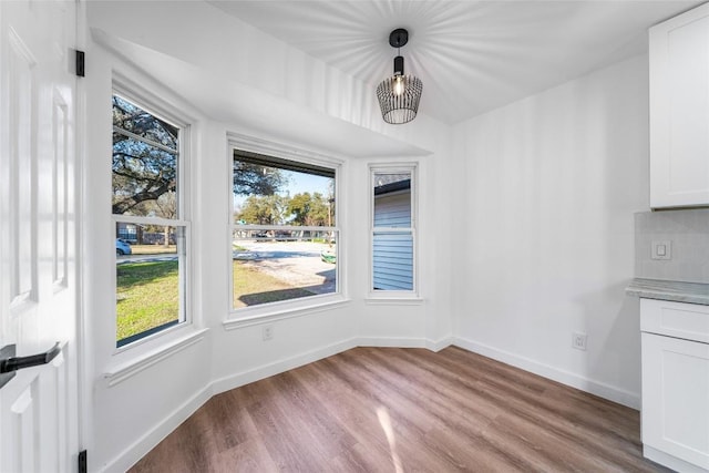 3507 Lovage Dr, Austin, TX 78727 - unfurnished dining area featuring healthy amount of natural light and wood finished floors