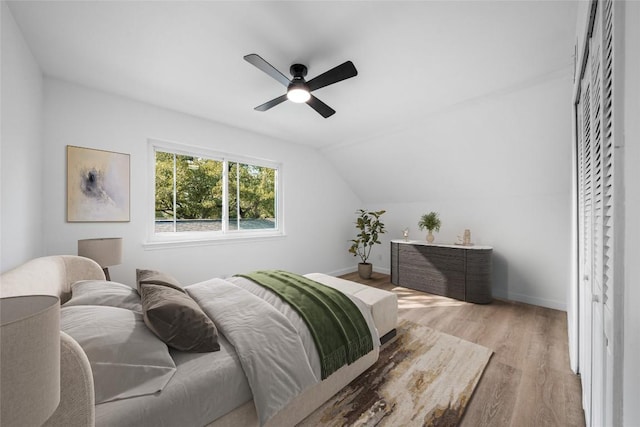 3507 Lovage Dr, Austin, TX 78727 - bedroom featuring wood finished floors, lofted ceiling, and a ceiling fan