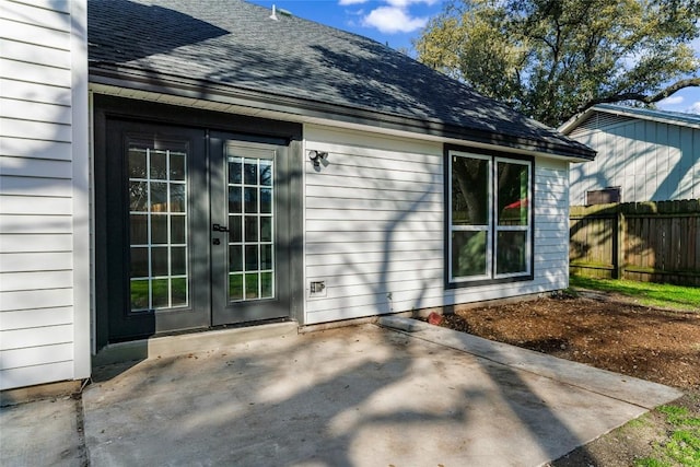 3507 Lovage Dr, Austin, TX 78727 - back of property with french doors, a patio area, and roof with shingles