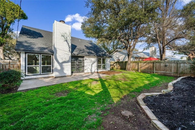 3507 Lovage Dr, Austin, TX 78727 - rear view of property featuring a chimney, a fenced backyard, a patio area, roof with shingles, and french doors