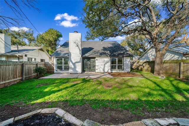 3507 Lovage Dr, Austin, TX 78727 - rear view of house with a chimney, a patio area, a fenced backyard, and french doors