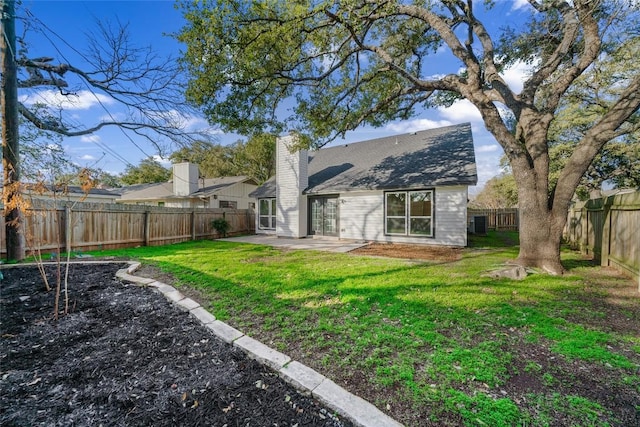 3507 Lovage Dr, Austin, TX 78727 - back of property featuring a patio area, a fenced backyard, and a chimney