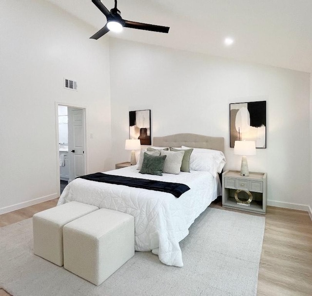 3507 Lovage Dr, Austin, TX 78727 - bedroom with light wood-type flooring, ceiling fan, high vaulted ceiling, and connected bathroom