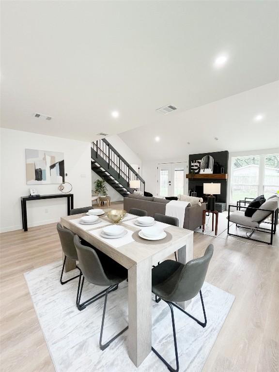 3507 Lovage Dr, Austin, TX 78727 - dining area featuring stairway, light wood-style flooring, and french doors