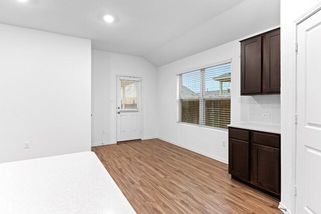 3201 Fresh Spring Rd, Pflugerville, TX 78660 - unfurnished dining area with light wood-style flooring, vaulted ceiling, recessed lighting, and baseboards