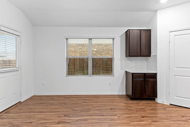 3201 Fresh Spring Rd, Pflugerville, TX 78660 - unfurnished room with light wood-style flooring, healthy amount of natural light, vaulted ceiling, and baseboards