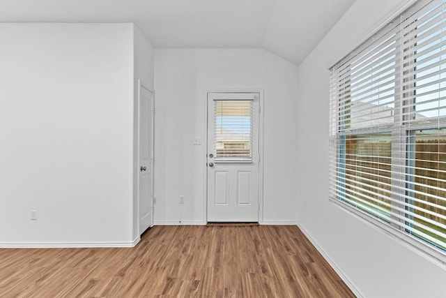 3201 Fresh Spring Rd, Pflugerville, TX 78660 - spare room featuring lofted ceiling, wood finished floors, and baseboards