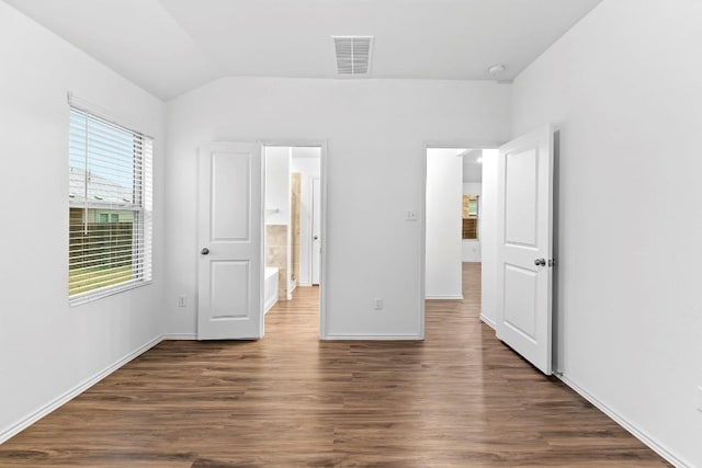 3201 Fresh Spring Rd, Pflugerville, TX 78660 - unfurnished bedroom with dark wood-style flooring, vaulted ceiling, and baseboards