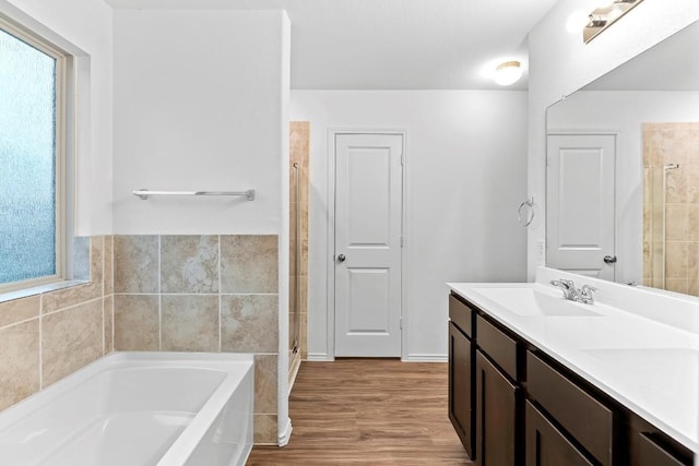 3201 Fresh Spring Rd, Pflugerville, TX 78660 - full bath featuring a bath, healthy amount of natural light, wood finished floors, a stall shower, and tile walls