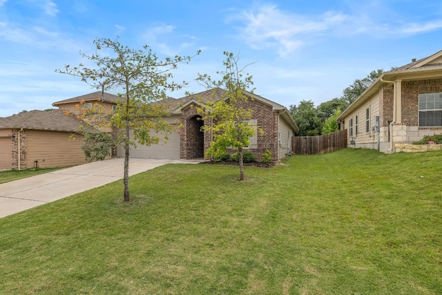 view of front of home with a garage and a front lawn