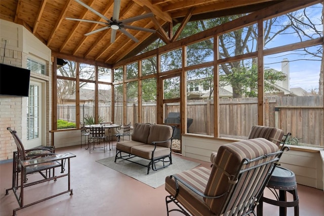 sunroom with vaulted ceiling and ceiling fan