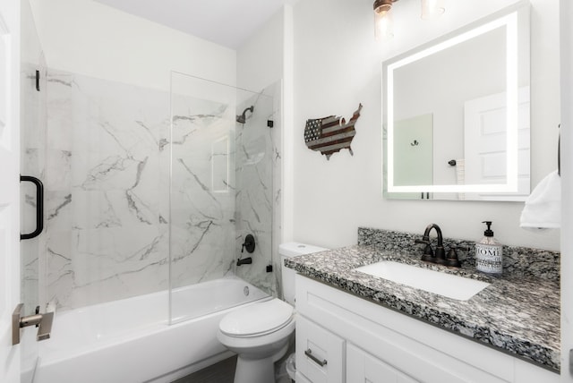 full bathroom featuring vanity, toilet, and tiled shower / bath combo