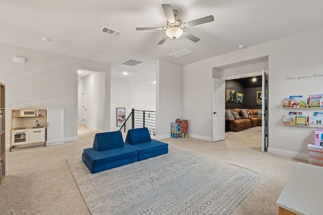208 Tovas Secret Cv, Georgetown, TX 78628 - sitting room featuring light colored carpet, an upstairs landing, and ceiling fan