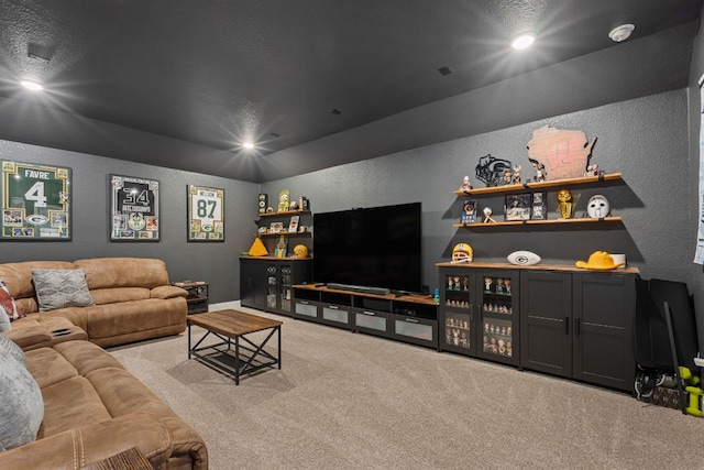 208 Tovas Secret Cv, Georgetown, TX 78628 - carpeted living room with a textured wall and recessed lighting