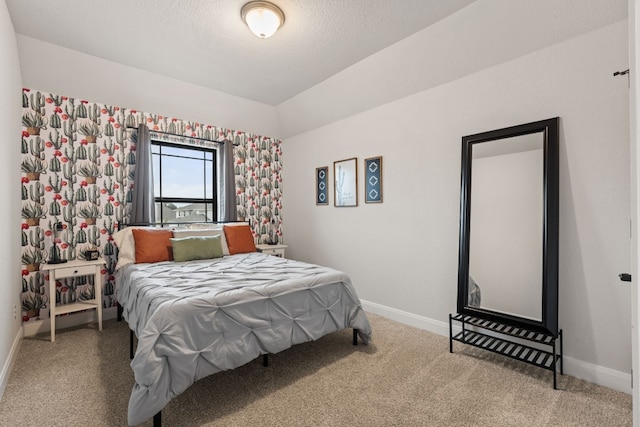 208 Tovas Secret Cv, Georgetown, TX 78628 - carpeted bedroom featuring a textured ceiling and vaulted ceiling