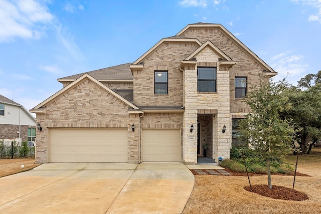 208 Tovas Secret Cv, Georgetown, TX 78628 - view of front of house featuring concrete driveway, brick siding, and roof with shingles