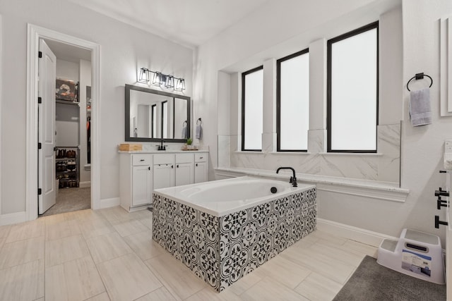 208 Tovas Secret Cv, Georgetown, TX 78628 - full bathroom with vanity and a garden tub