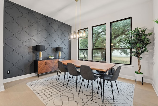 208 Tovas Secret Cv, Georgetown, TX 78628 - dining space with baseboards and an accent wall