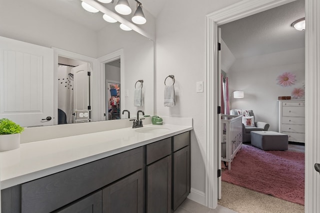 208 Tovas Secret Cv, Georgetown, TX 78628 - bathroom featuring vanity and baseboards