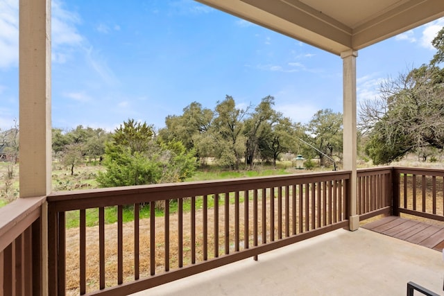 208 Tovas Secret Cv, Georgetown, TX 78628 - balcony featuring view of wooded area