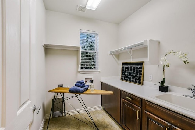 317 Yellow Rose Trl, Georgetown, TX 78633 - home office featuring baseboards and a sink