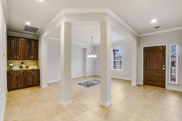317 Yellow Rose Trl, Georgetown, TX 78633 - entryway with a chandelier, ornamental molding, light tile patterned floors, recessed lighting, and baseboards