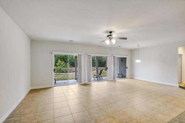 317 Yellow Rose Trl, Georgetown, TX 78633 - empty room featuring ceiling fan, baseboards, and light tile patterned flooring