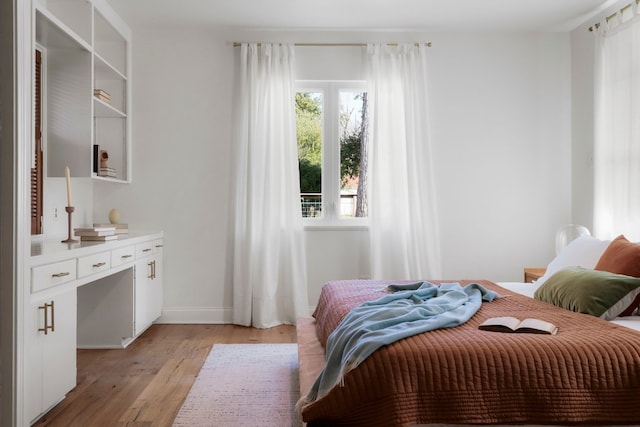 bedroom with light wood-type flooring