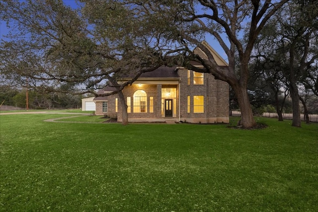 view of front facade featuring a garage and a front lawn